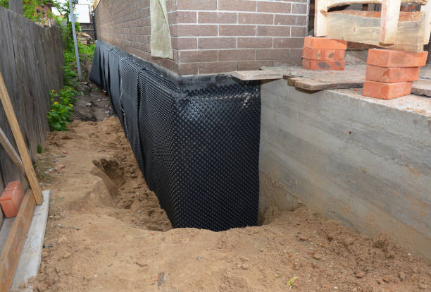 Happy homeowners after waterproofing job in Fork